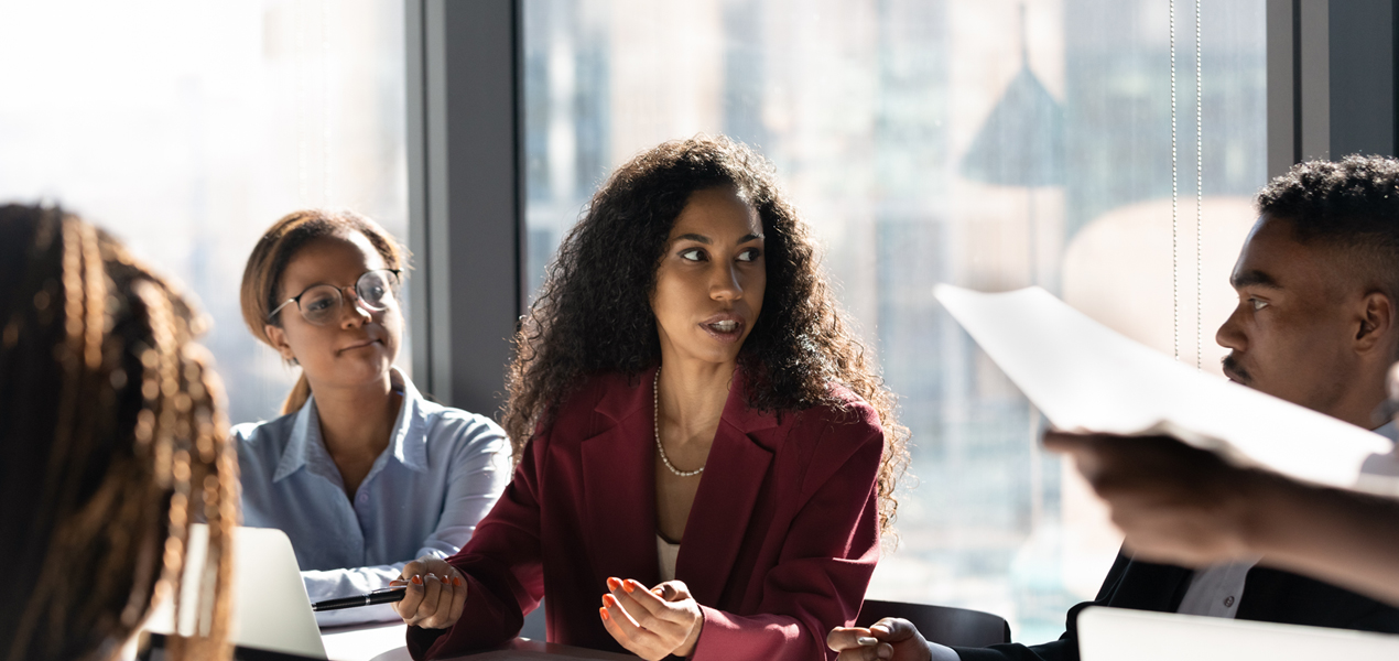 Workers and managers brainstorming ideas in a meeting.