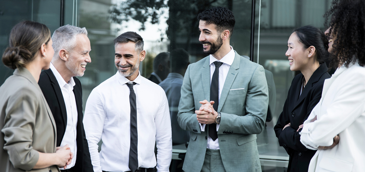 Business group having a casual meeting outdoors.